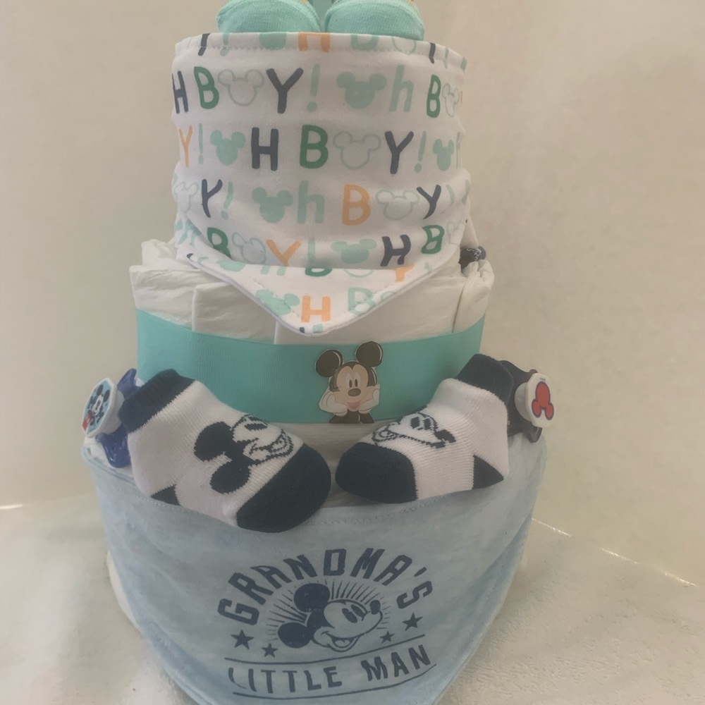 New Mickey Mouse diaper cake.50 diapers, 3 bibs, 2pair of socks 3 pacifiers